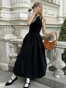 Vintage Hepburn style sleeveless black knitted maxi dress with a cinched waist design