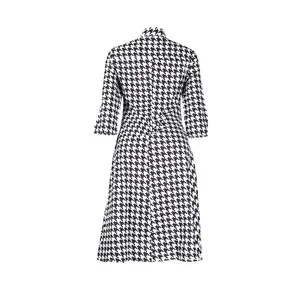 Back view of slim fit houndstooth dress featuring three-quarter sleeves and lapel