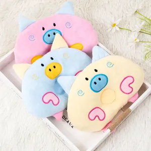 Three cute cartoon pig shaped plush pet pillows in pink blue and yellow colors for cats