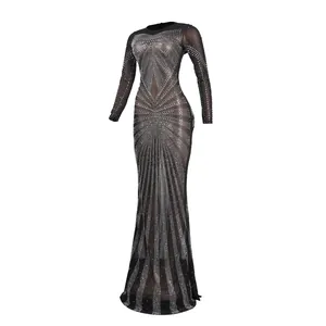 Detail view of a sexy black sheer rhinestone floor-length dress with long sleeves