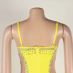 Close-up of yellow rhinestone dinner dress with mesh panels and adjustable straps