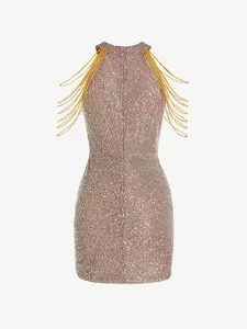 Detail view of a rose gold sequined halter dress featuring elegant gold shoulder fringe.