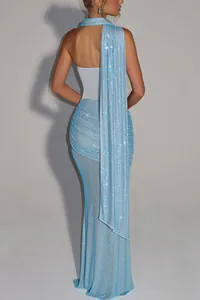 Back view of a light blue sequin evening gown with elegant draped shawl detail