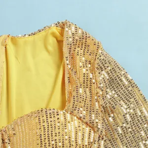 Detail view showing golden sequin texture and smooth yellow lining of an evening dress