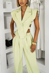 Detailed view of the trendy lime green sleeveless blazer with side cutouts and pants