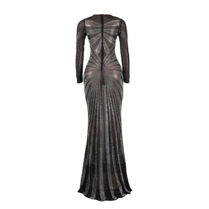 Detailed back view of an elegant black mesh floor-length gown with sparkling rhinestone patterns