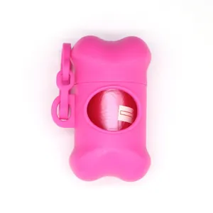 Detail of a pink bone-shaped pet waste bag dispenser with a convenient hanging hook.
