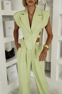 Fashionable light green sleeveless blazer vest paired with high-waist wide-leg trousers