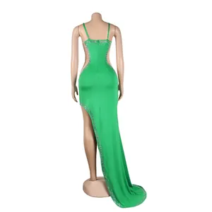Back view of sexy green formal evening gown with rhinestones and sheer mesh panels
