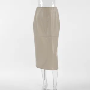 Close-up of khaki PU leather midi pencil skirt shown on a transparent mannequin
