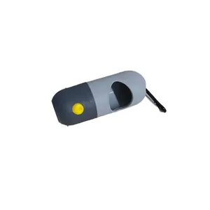 Tragbarer Kapsel-Hundebeutelspender mit LED-Licht und Karabiner in grauer Farbe.