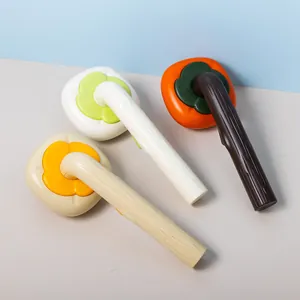 Persimmon-shaped self-cleaning pet brushes with wood texture handles in multiple colors