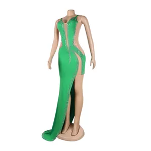 Full view of the green evening dress with rhinestones on a mannequin, white background