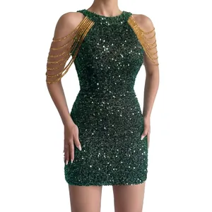Detail view of emerald green sequin bodycon dress with elegant gold chain shoulder tassels