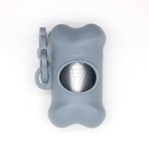 Close-up of a bone-shaped pet waste bag dispenser in gray with side hook attachment