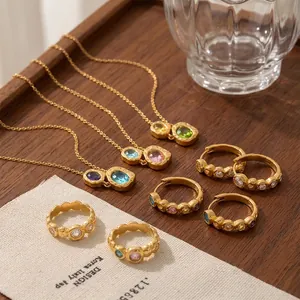 Collection of vintage hammered 18K gold plated stainless steel jewelry with gemstones