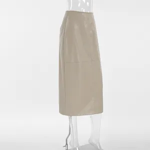 Detailed side view of a khaki PU leather midi pencil skirt on a clear mannequin