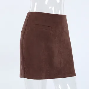 Detailed macro shot of vintage brown suede high-waist mini skirt texture