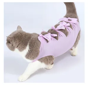 Detail of cat recovery suit featuring purple breathable fabric with cute decorative bow ties.