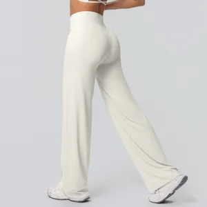 Detail view of cream high-waisted yoga flare pants in soft brushed fabric for fitness
