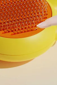 Macro detail of pet self-cleaning slicker brush with stainless steel massage needles
