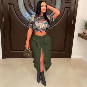 Full body view of a stylish green cargo maxi skirt featuring zippers and utility pockets