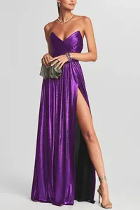 Elegant purple strapless evening gown with pleated texture and a high leg slit detail.