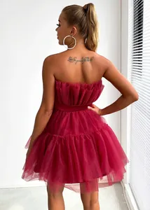 Back view of a strapless burgundy tulle mini dress featuring layered mesh texture