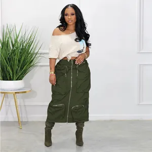 Stylish full body shot of army green cargo skirt with multiple zippers and pockets on model