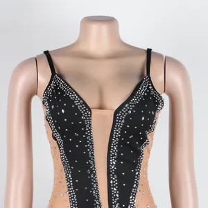 Detailed close-up view of black rhinestone-embellished translucent mesh bodycon dress
