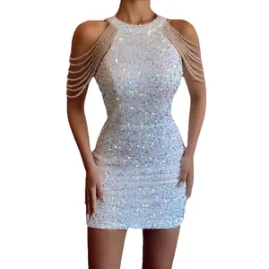 Elegant white sequin halter dress with crystal shoulder chains for evening party.