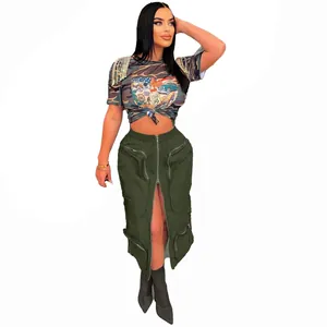 Full view of trendy olive green cargo skirt with zipper details and camo crop top.