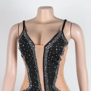 Close-up detail of a sexy mesh see-through rhinestone slip dress on a mannequin