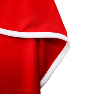Macro detail of red dress showing elegant white contrast piping and fabric texture