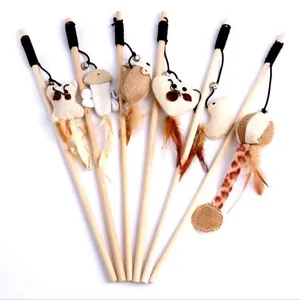 Detailed view of wooden cat teaser wands with various fabric shapes and feathers
