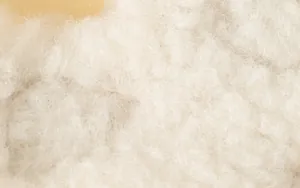 Detailed macro view showing the soft white lamb wool texture of the dog harness material