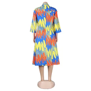 Rear view detail of a vibrant abstract print slim fit midi dress with a colorful pattern