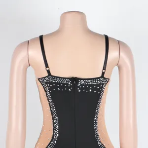 Detail view of the back of a sexy mesh bodycon dress with rhinestone accents.