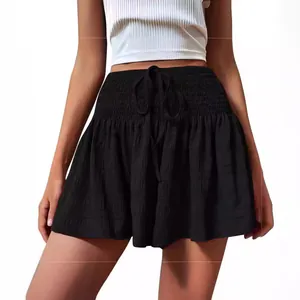 Stylish women's black high waisted smocked shorts with adjustable drawstring hem.