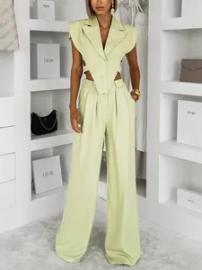 Fashionable light green two-piece set with sleeveless waist-hollowed blazer and trousers