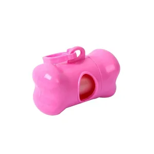 Bone-shaped pink dog poop bag dispenser for outdoor waste cleanup and pet accessories.