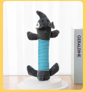 Detailed view of long elephant-shaped plush squeaky toy for small dogs on display