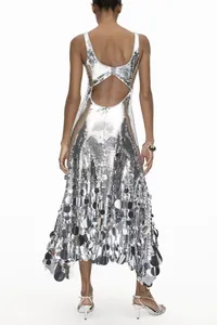 Close-up detail showing the back cutout and sparkling silver sequins of this evening gown