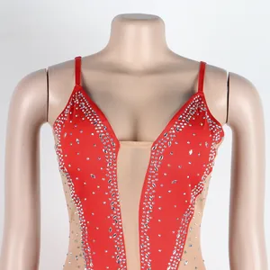 Detailed close-up of a sexy red evening dress featuring rhinestones and mesh panels