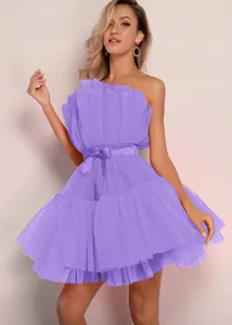 Elegant detail showing the texture of a purple tube top tulle party dress with a bow.