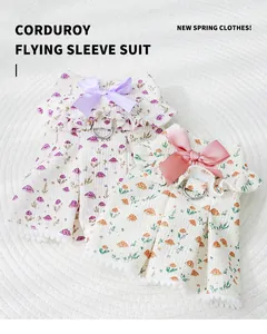 Detail view of corduroy mushroom print pet dresses with decorative bows