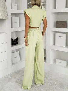 Elegant pistachio green two-piece set with sleeveless vest and wide leg trousers