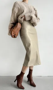 Elegant khaki PU leather midi pencil skirt styled with a cozy beige knit sweater.