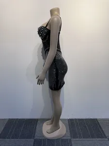 Side view of black bodycon mini dress with luxury rhinestone and pearl details
