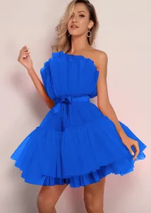 Detailed view of the bright blue strapless layered tulle mini dress with a waist bow.